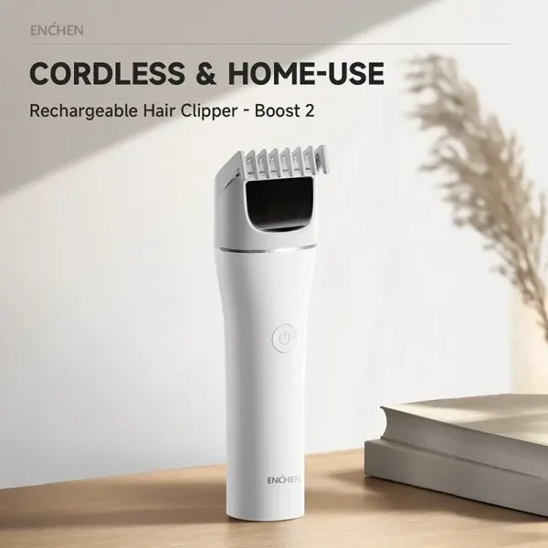 The white Enchen Boost 2 rechargeable hair clipper sitting on a desk, highlighting its cordless design for easy home use.